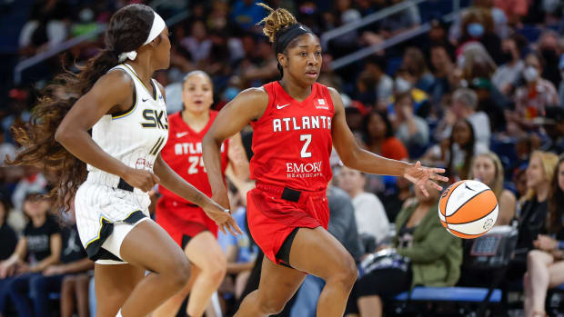 Dream guard Aari McDonald drives to the basket against Sky guard Dana Evans.
